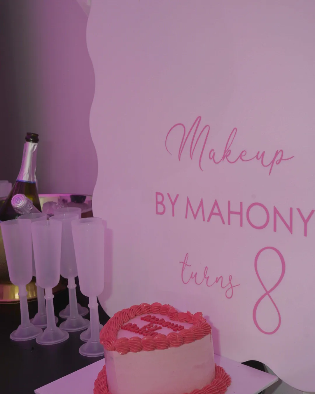 The cake and signage table at the Makeup by Mahony eighth birthday launch