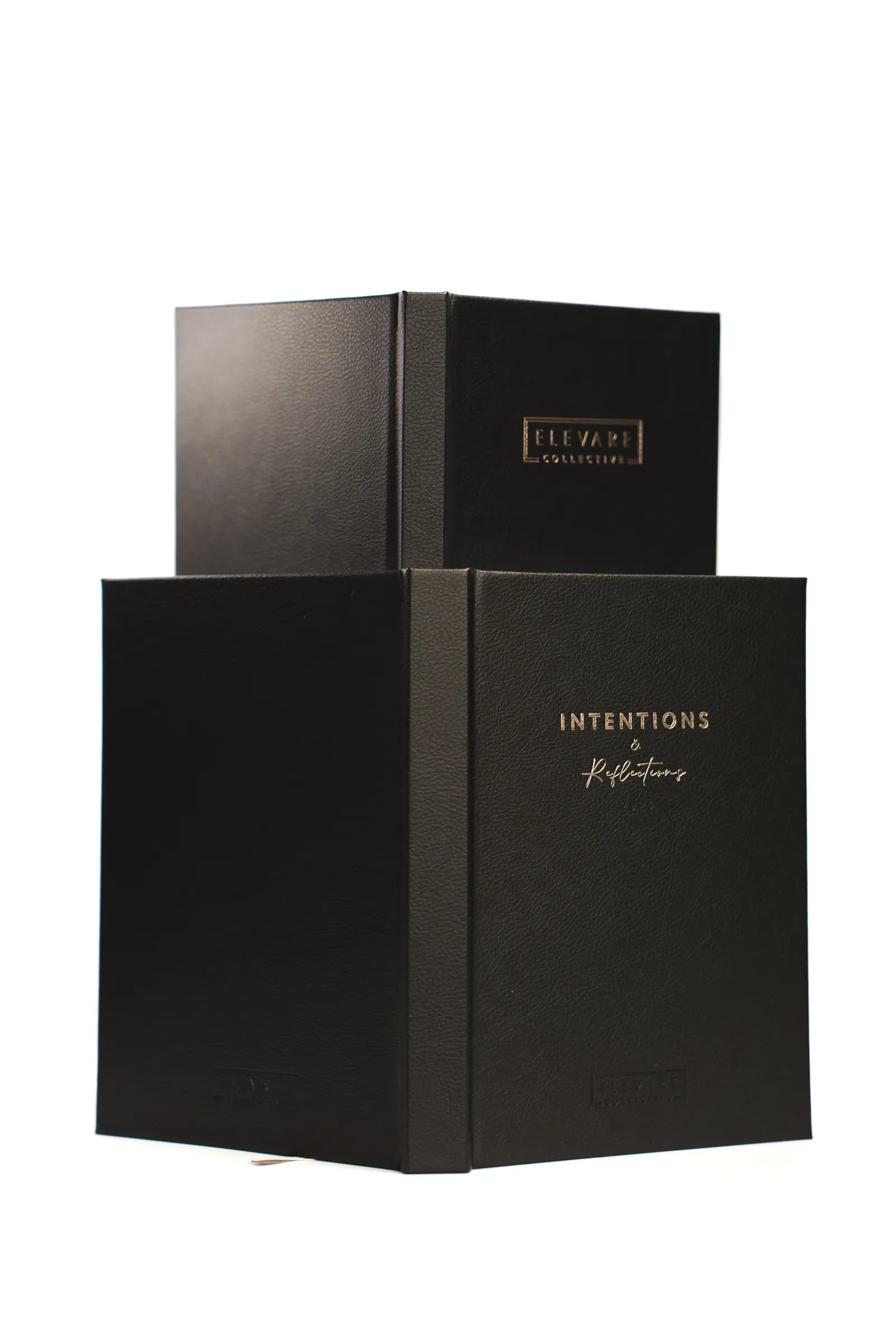 Black Intentions gift boxes stacked on white